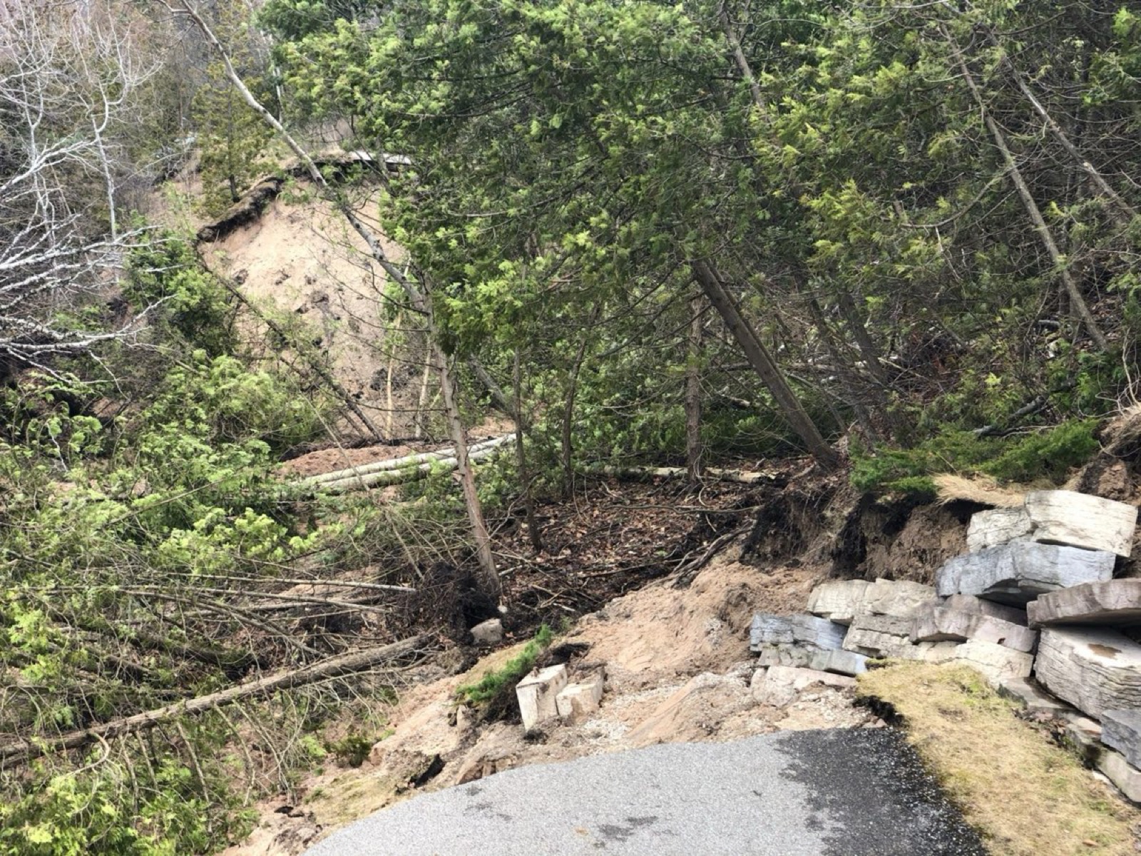 Volunteers restoring a washed-out section of the Little Traverse Wheelway